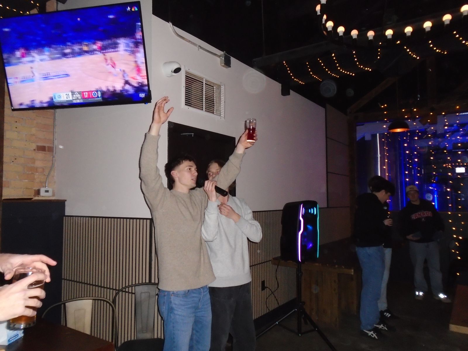 Members cheering at a social