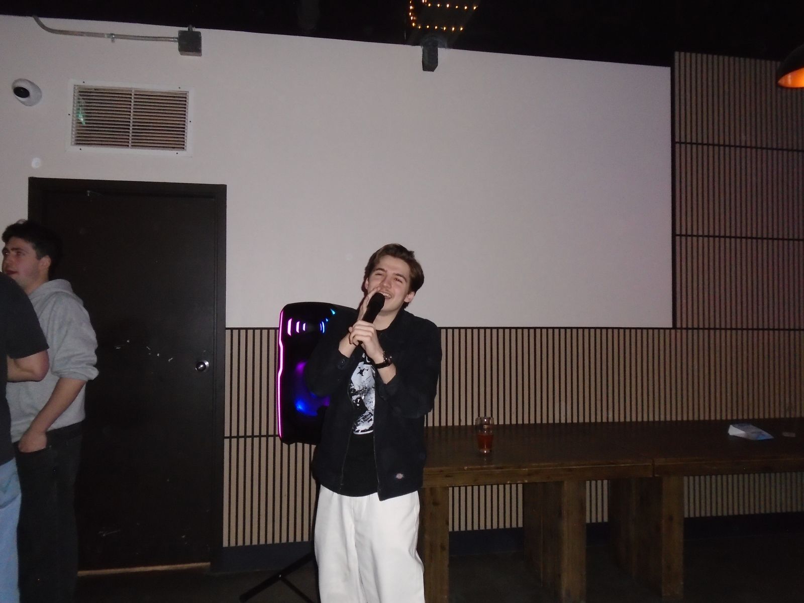Member singing karaoke