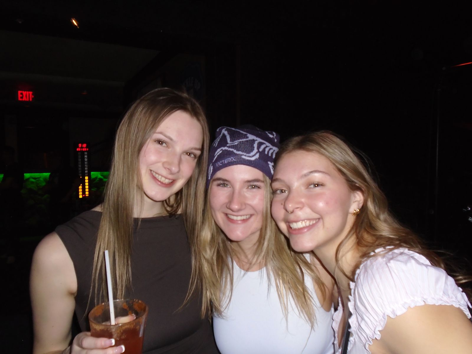 Three friends posing together