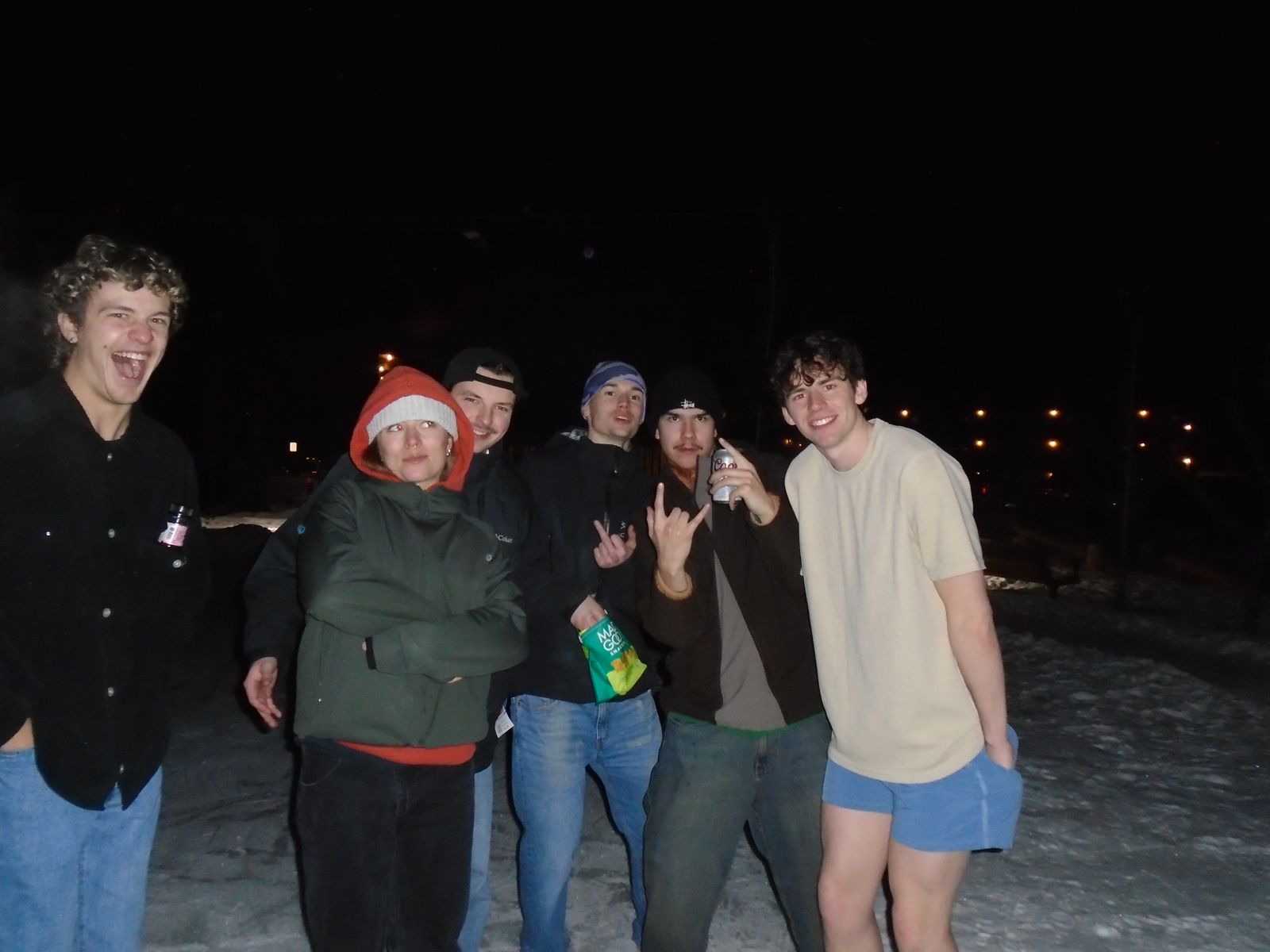Members outside on a snowy night