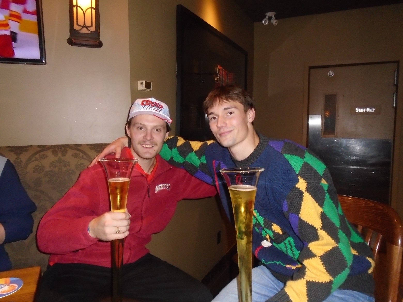 Two members raising yard glasses