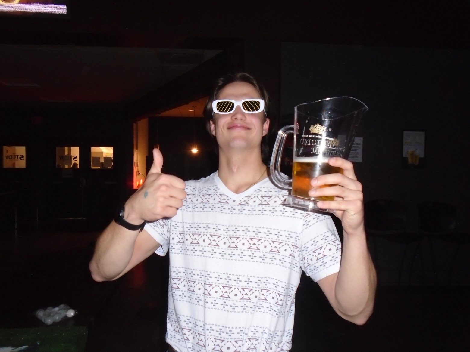 Member giving a thumbs up with a pitcher